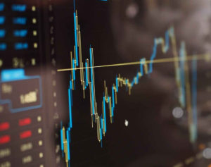 blue and yellow graph on stock market monitor